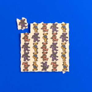 Grateful Dead LSD tabs on blue background